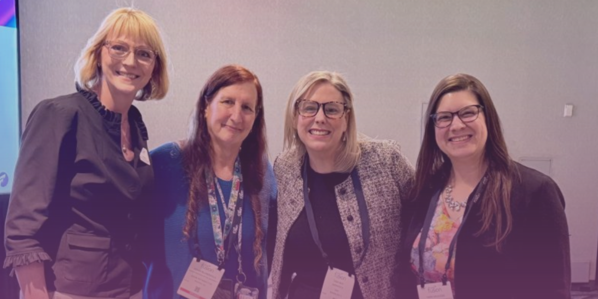 Four women, including Joann Blumenfeld, Tara May, and Tara Havlicek smile in a group photo taken at SME Fusion 2025. 